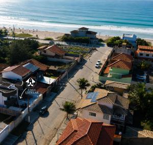 an aerial view of a town with the beach at Casa Estelar in Cabo Frio