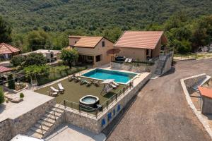 an aerial view of a house with a swimming pool at Aria in Cetinje