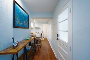 a hallway with a table and chairs in a room at Dolphin Retreat in Brunswick +6 photos