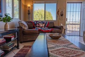 a living room with a couch and a table at Serenity at Rimrock in Rimrock