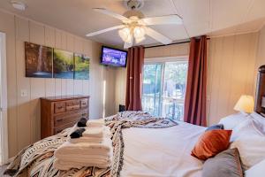 a bedroom with a bed and a ceiling fan at Serenity at Rimrock in Rimrock