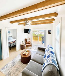 a living room with a couch and a table at Wild Cove Nook in Twillingate