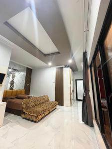 a bedroom with a bed and a ceiling at Nameera house in Makassar +15 photos