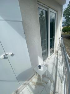 a balcony with a toilet on the side of a building at TURKERHOMe in Ordu +4 photos