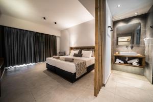 a hotel room with a bed and a sink at Harmony Crest Resort in Kos +47 photos