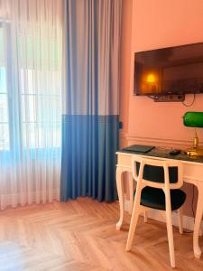 a desk with a chair in a room with a window at D-orients in Istanbul