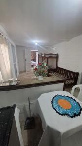 a room with a table with a cake on it at Kitnetilha in Itamaracá