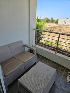 a couch and a table in a room with a window at Rakkez's house in Hiboun