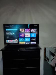a flat screen tv sitting on top of a dresser at Acogedor estudio cerca del aeropuerto in Tijuana +4 photos