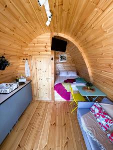 a room with a bed in a wooden cabin at LEIRIA Side Bungalow in Leiria