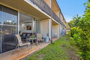 a house with a patio with a couch and a table at Napili Ridge K6 in Napili-Honokowai