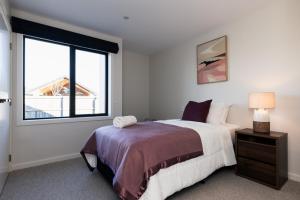 a bedroom with a large bed and a window at Alpine Retreat in Methven +116 photos