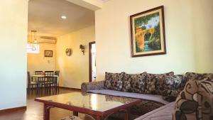 a living room with a couch and a table at Indigo House in Chefchaouen