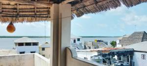 a view of the water from a building window at Lola House in Lamu