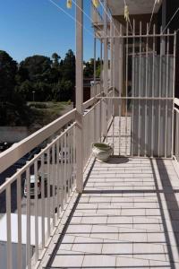 a balcony of a building with a bowl on it at Brighella in Putignano