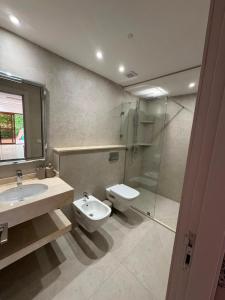 a bathroom with a sink and a toilet and a shower at Studio marina smir in Marina Smir +19 photos