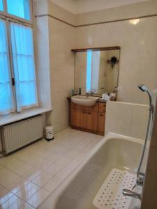 a bathroom with a tub and a sink at Affittacamere Borgo Antico in Venzone +25 photos