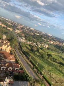 an aerial view of a town with houses and a road at Tsavo Rising in Nairobi