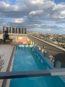 a swimming pool on the roof of a building at Tsavo Rising in Nairobi