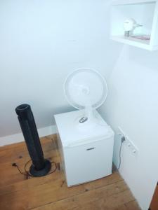 a white fan sitting on top of a box at Bungalov A in Sveti Filip i Jakov