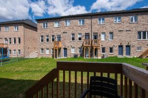 a view of a brick building from a balcony at Modern Luxury Townhouse in Cambridge