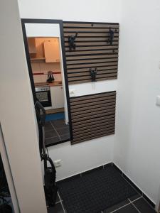 a door leading into a room with a mirror at Monica Inn in Passau