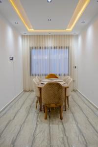 a dining room with a table and chairs at Villa Ghizen in Fafou +29 photos