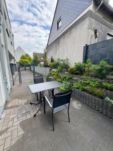 a table and chairs sitting on a patio at Luxuriöse Apartment in Bochum