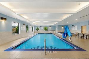 a swimming pool in a hotel room at Holiday Inn Express & Suites Salt Lake City South-Murray by IHG in Murray