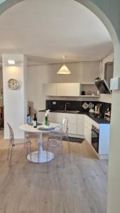 a kitchen with a table and chairs in a room at CasaLù in Lanciano