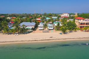 an aerial view of a beach with houses at Tri Tan Beach Cabanas in Placencia