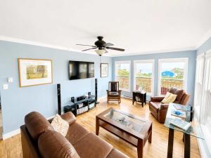 a living room with a couch and a table at Whistler's View in Twillingate