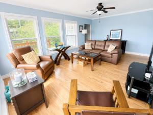 a living room with a couch and a table at Whistler's View in Twillingate