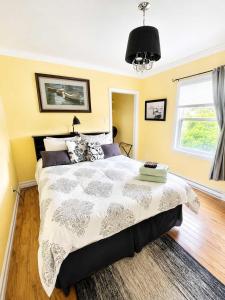a bedroom with a large bed and a window at Whistler's View in Twillingate +7 photos