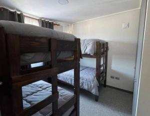 a room with two bunk beds in a room at Hipolito in La Serena