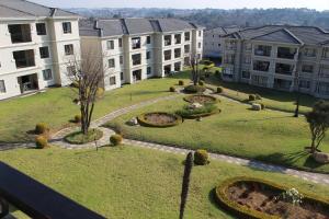 an aerial view of a courtyard in a building at First Gen Cedar Acres Fourways in Trevallyn