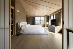 a bedroom with a white bed and a television at THE HOTEL HIGASHIYAMA KYOTO TOKYU, A Pan Pacific Hotel in Kyoto +26 photos