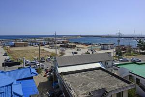 an aerial view of a parking lot with a harbor at Yangyang susan motel in Yangyang
