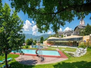 a view of a resort with a swimming pool at Fanningberg in Mariapfarr