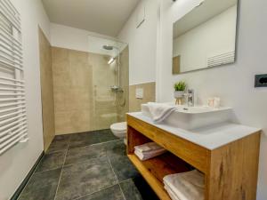 a bathroom with a sink and a toilet at Bockblick Top 5 in Weisspriach