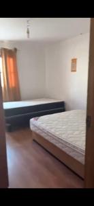 a bed in a room with a mattressvisor at Casa La Tirana Parcela 43 in La Tirana