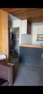 a kitchen with a counter and a toilet in a room at Casa La Tirana Parcela 43 in La Tirana