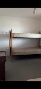 a bedroom with a bunk bed in a room at Casa La Tirana Parcela 43 in La Tirana