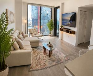 a living room with a couch and a table at The Downtown Luxury Collection in Miami