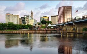 a bridge over a river with a city in the background at Knights Inn Hartford in Hartford