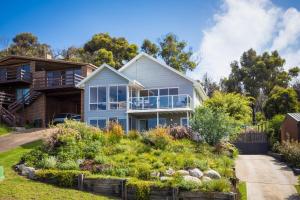 a house on a hill with a garden at Wild Views in Tathra