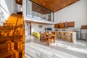 a kitchen and dining room with a table and chairs at Darina Villa - Private Rooftop Escape with Pool Close to Beach in Badung +14 photos