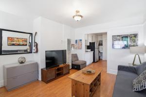 a living room with a couch and a flat screen tv at Golden Hill 1 bedrooms in San Diego
