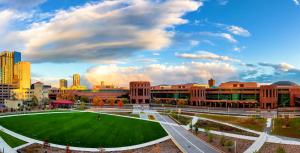a campus with a green lawn in front of buildings at Hotel Indigo - Minneapolis Downtown by IHG in Minneapolis