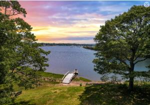 a view of a large body of water with a dock at Lakefront Guesthouse w Sunrise View Dock in Stonington
